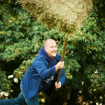 participant throwing a straw bale during the Forest Games
