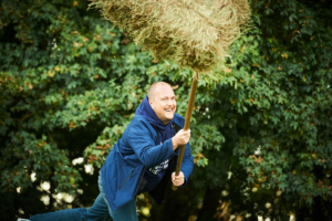 participant throwing a straw bale during the Forest Games