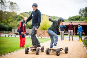 participants on electric skateboards during the 1001 milestones