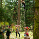 participant climbing a commando ladder during the Step out of your comfort zone