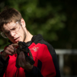 participant aiming and firing an air pistol during Castle Investigation